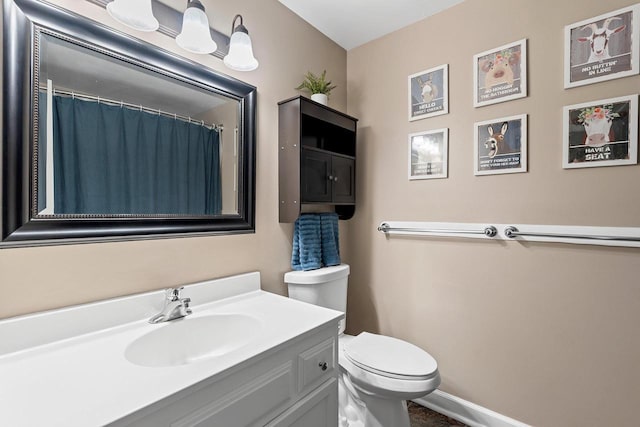 2127 Jen Rae Rd, Green Bay, WI 54311 - full bath featuring toilet, vanity, and baseboards