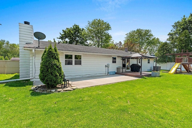 2127 Jen Rae Rd, Green Bay, WI 54311 - back of house with a gazebo, a chimney, a patio, and a playground