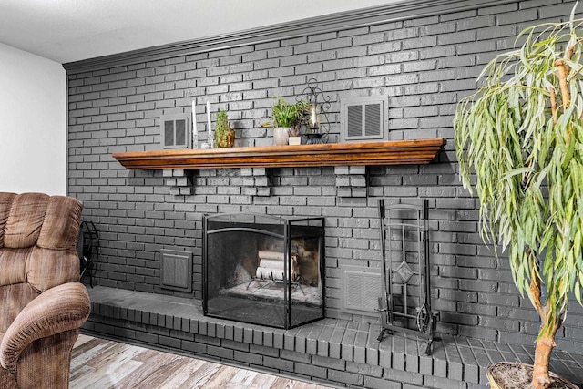 2127 Jen Rae Rd, Green Bay, WI 54311 - detailed view of wood finished floors and a brick fireplace