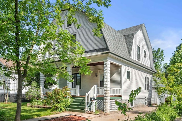 1608 Ellis St, Stevens Point, WI 54481 - view of front of property with roof with shingles, covered porch, and a gambrel roof