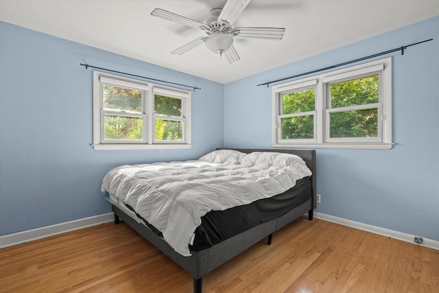 6207 S 123rd St, Hales Corners, WI 53130 - bedroom with baseboards, light wood-style floors, and ceiling fan