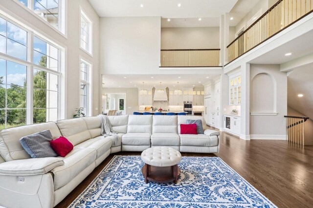 10031 N Range Line Rd, Mequon, WI 53092 - living room featuring a high ceiling, dark wood-style flooring, and recessed lighting