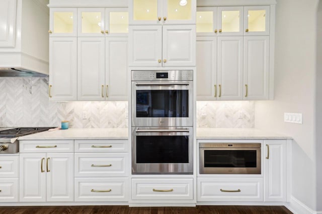 10031 N Range Line Rd, Mequon, WI 53092 - kitchen featuring stainless steel appliances, decorative backsplash, and white cabinets