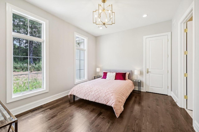 10031 N Range Line Rd, Mequon, WI 53092 - bedroom with multiple windows, a chandelier, dark wood finished floors, and recessed lighting