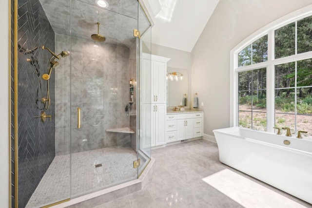 10031 N Range Line Rd, Mequon, WI 53092 - full bath featuring a freestanding tub, vanity, a stall shower, and lofted ceiling