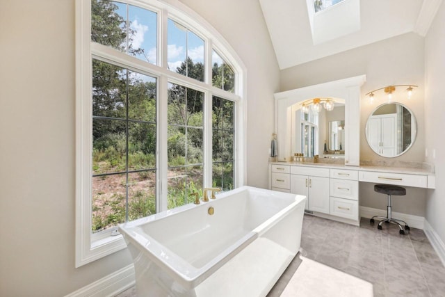 10031 N Range Line Rd, Mequon, WI 53092 - full bathroom with a freestanding bath, vanity, and a skylight