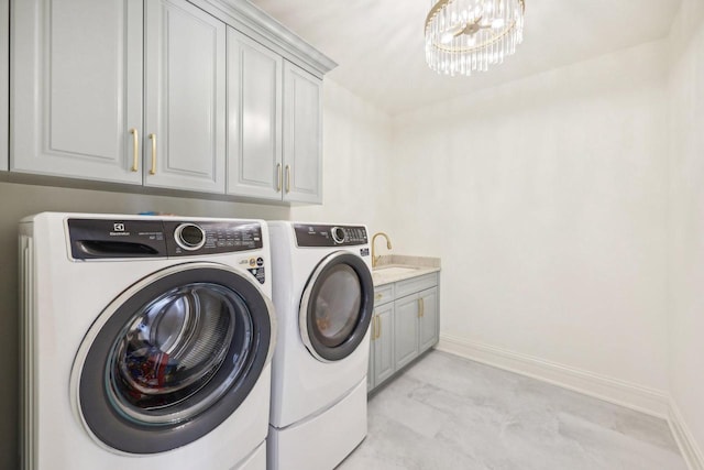 10031 N Range Line Rd, Mequon, WI 53092 - laundry area with independent washer and dryer, cabinet space, and a chandelier