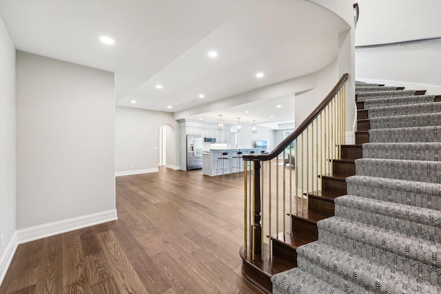10031 N Range Line Rd, Mequon, WI 53092 - stairway featuring wood finished floors and recessed lighting