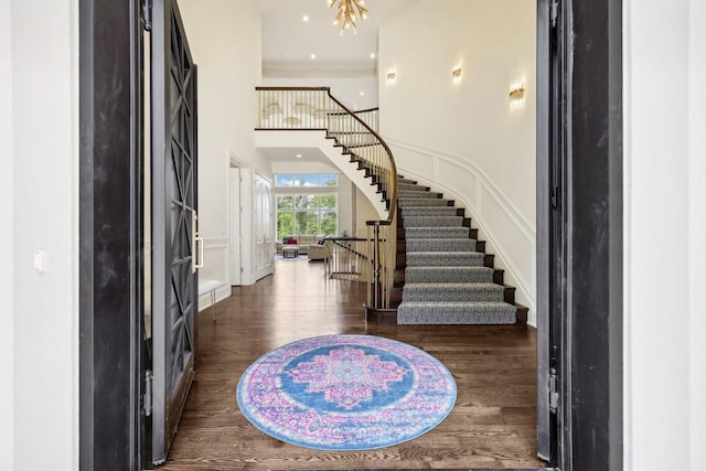 10031 N Range Line Rd, Mequon, WI 53092 - foyer with stairs, dark wood-style flooring, and a high ceiling
