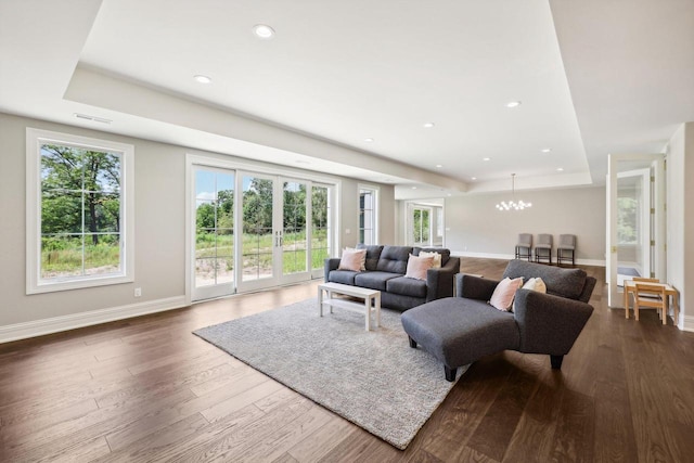 10031 N Range Line Rd, Mequon, WI 53092 - living area featuring a chandelier, dark wood-type flooring, a tray ceiling, and recessed lighting