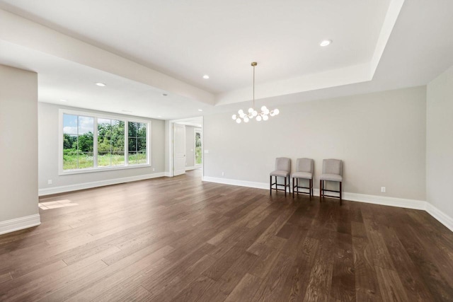 10031 N Range Line Rd, Mequon, WI 53092 - unfurnished room featuring dark wood-style floors, a chandelier, a tray ceiling, and recessed lighting