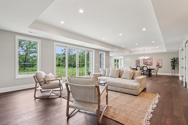 10031 N Range Line Rd, Mequon, WI 53092 - living area featuring a raised ceiling, healthy amount of natural light, dark wood-style flooring, and recessed lighting