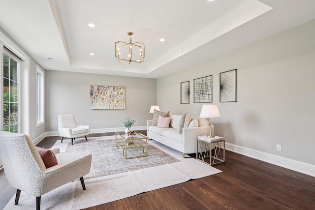 10031 N Range Line Rd, Mequon, WI 53092 - living room with a raised ceiling, wood finished floors, a chandelier, and recessed lighting