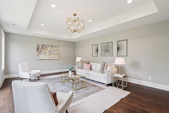 10031 N Range Line Rd, Mequon, WI 53092 - living room featuring a raised ceiling, recessed lighting, wood finished floors, and a chandelier