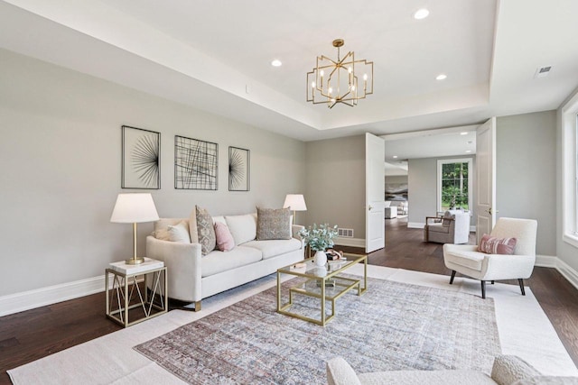 10031 N Range Line Rd, Mequon, WI 53092 - living area featuring wood finished floors, recessed lighting, a raised ceiling, and a chandelier