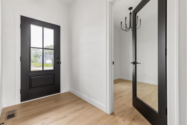 2590 N Stellita Cir, De Pere, WI 54115 - foyer entrance featuring baseboards and light wood-style flooring