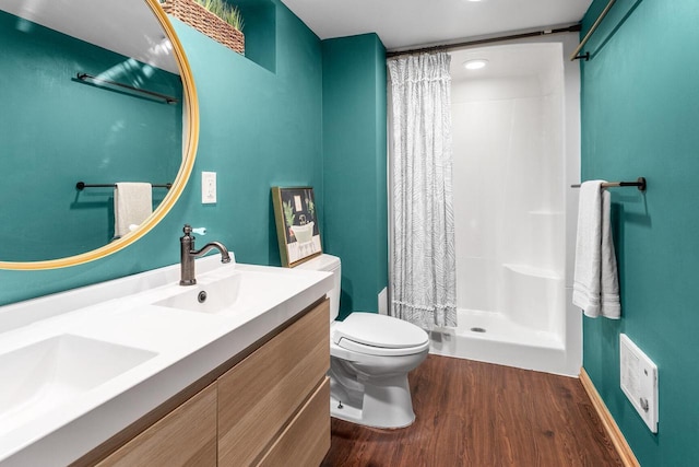 W62N322 Hanover Ave, Cedarburg, WI 53012 - bathroom featuring wood finished floors, toilet, double vanity, and a shower with curtain