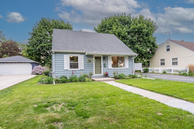 W62N322 Hanover Ave, Cedarburg, WI 53012 - bungalow-style home with an outdoor structure, a detached garage, and roof with shingles