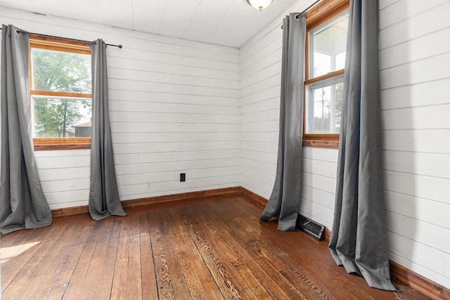 N3438 State Rd 76, Hortonville, WI 54944 - spare room with dark wood finished floors, baseboards, and wood walls