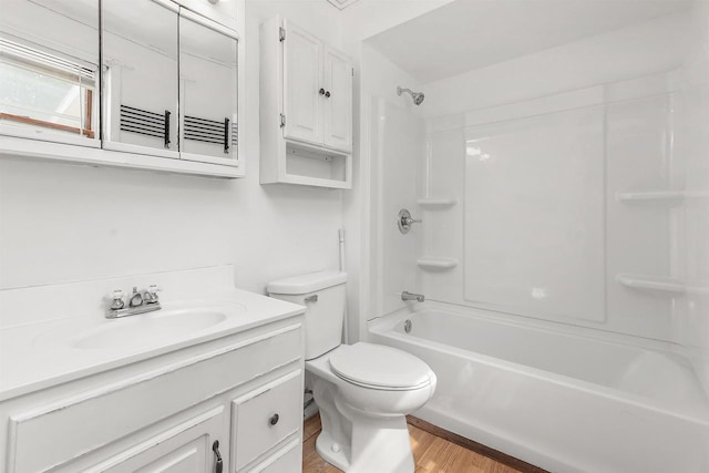 N3438 State Rd 76, Hortonville, WI 54944 - bathroom with vanity, washtub / shower combination, toilet, and wood finished floors