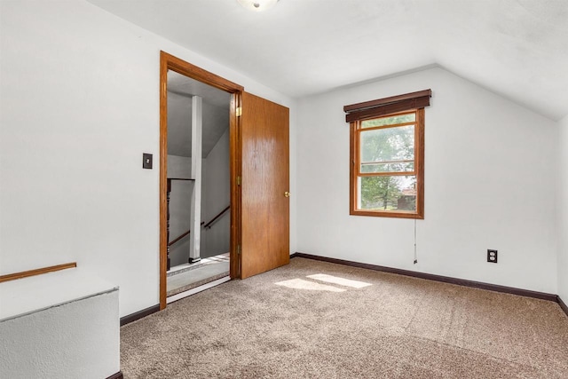 N3438 State Rd 76, Hortonville, WI 54944 - unfurnished bedroom featuring vaulted ceiling, carpet flooring, and baseboards