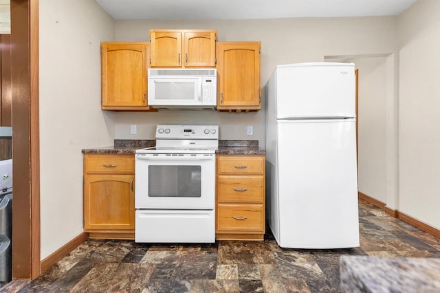 N3438 State Rd 76, Hortonville, WI 54944 - kitchen featuring white appliances, dark countertops, baseboards, and stone finish flooring