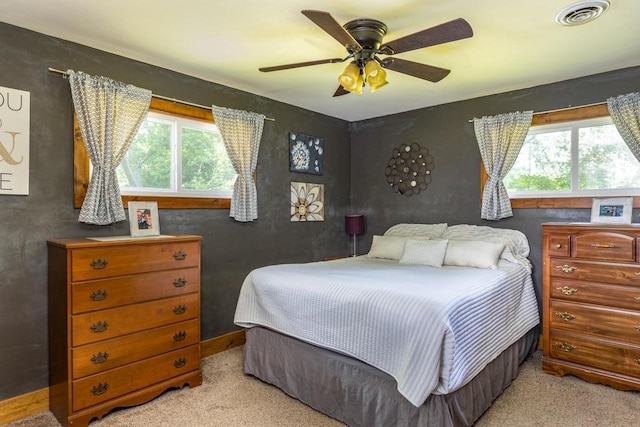 2946 Shadow Ln, Oshkosh, WI 54901 - carpeted bedroom featuring multiple windows and ceiling fan
