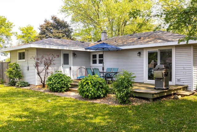 2946 Shadow Ln, Oshkosh, WI 54901 - rear view of house with a deck and roof with shingles