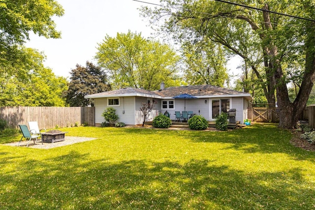 2946 Shadow Ln, Oshkosh, WI 54901 - back of house with a fire pit and a wooden deck