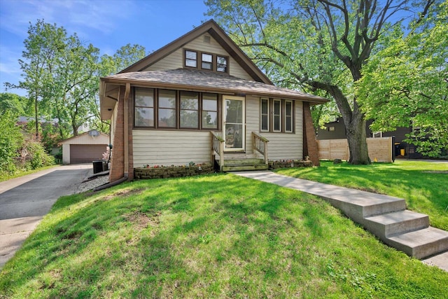 8511 W Orchard St, West Allis, WI 53214 - bungalow-style home featuring an outbuilding, a garage, and entry steps