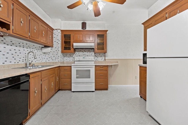 8511 W Orchard St, West Allis, WI 53214 - kitchen with white appliances, a sink, under cabinet range hood, ceiling fan, and brown cabinetry