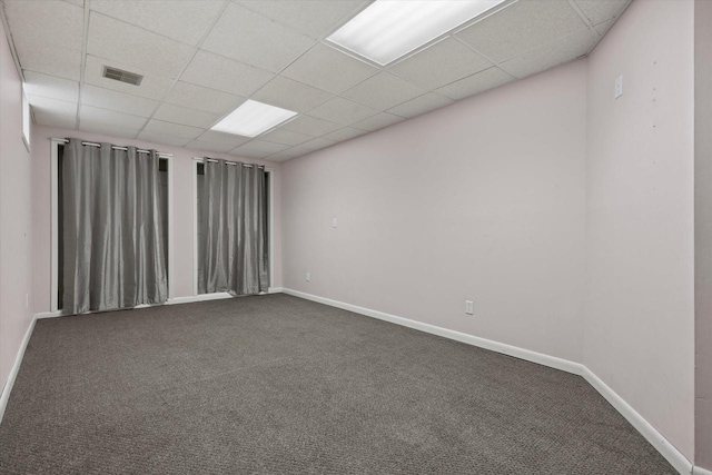 8511 W Orchard St, West Allis, WI 53214 - spare room featuring dark carpet, a drop ceiling, and baseboards