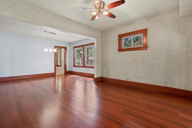 8511 W Orchard St, West Allis, WI 53214 - empty room with ceiling fan, wood finished floors, and baseboards