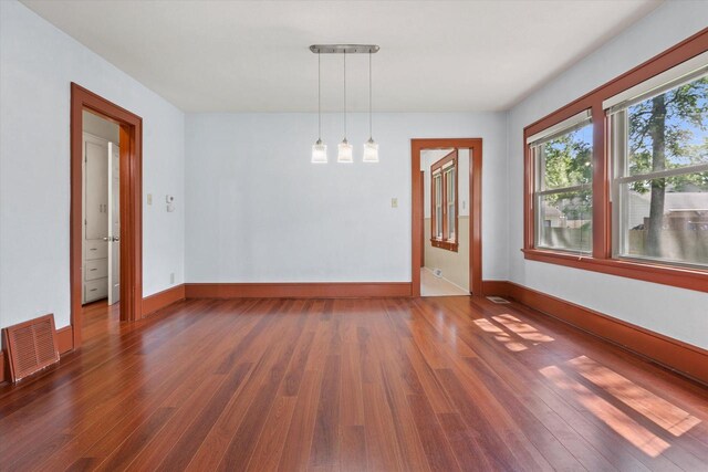 8511 W Orchard St, West Allis, WI 53214 - spare room featuring wood finished floors and baseboards