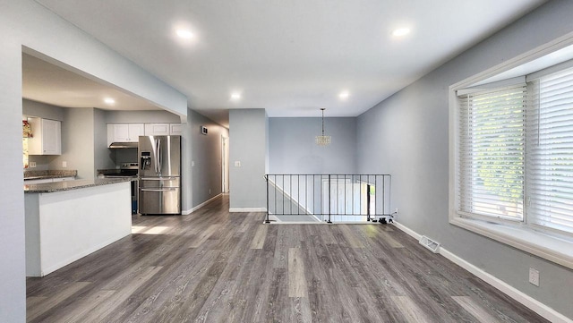 9085 N Joyce Ave, Milwaukee, WI 53224 - kitchen featuring appliances with stainless steel finishes, white cabinetry, dark wood-type flooring, healthy amount of natural light, and recessed lighting