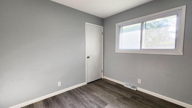 9085 N Joyce Ave, Milwaukee, WI 53224 - unfurnished room with baseboards and dark wood-style flooring