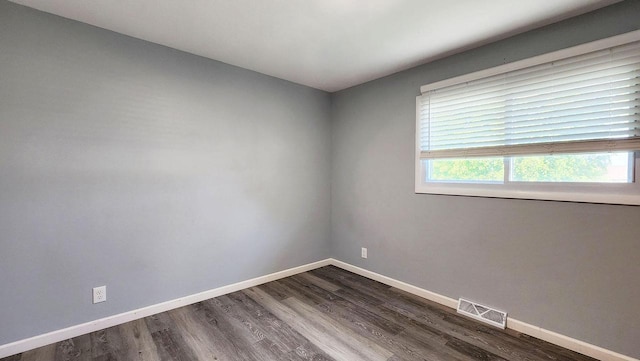 9085 N Joyce Ave, Milwaukee, WI 53224 - empty room featuring dark wood-style flooring and baseboards