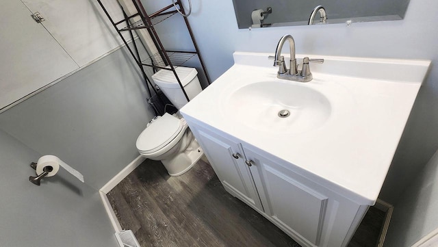 9085 N Joyce Ave, Milwaukee, WI 53224 - half bath with wood finished floors, toilet, and vanity
