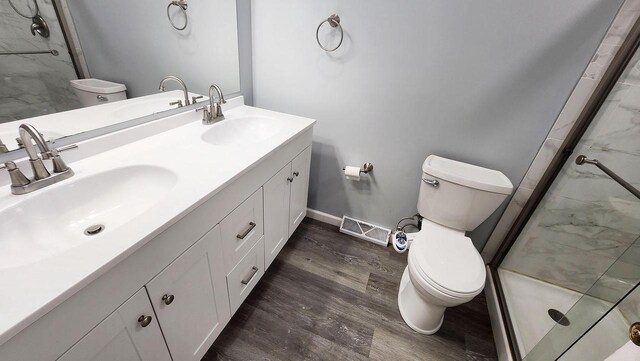 9085 N Joyce Ave, Milwaukee, WI 53224 - bathroom with toilet, wood finished floors, and a stall shower