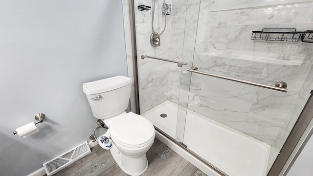 9085 N Joyce Ave, Milwaukee, WI 53224 - full bath featuring toilet, a marble finish shower, and wood finished floors