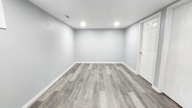 9085 N Joyce Ave, Milwaukee, WI 53224 - unfurnished room with wood finished floors, baseboards, and recessed lighting