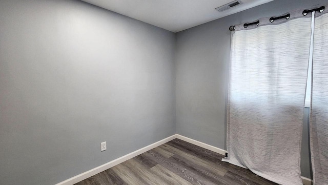 9085 N Joyce Ave, Milwaukee, WI 53224 - empty room with dark wood-type flooring and baseboards
