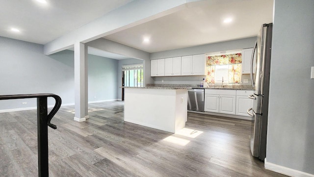 9085 N Joyce Ave, Milwaukee, WI 53224 - kitchen with appliances with stainless steel finishes, healthy amount of natural light, white cabinetry, baseboards, and recessed lighting