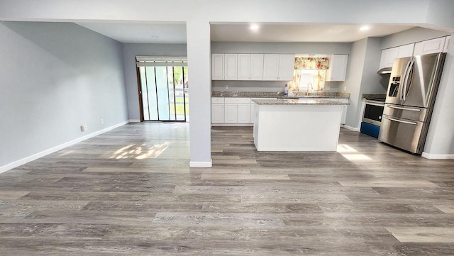 9085 N Joyce Ave, Milwaukee, WI 53224 - kitchen featuring appliances with stainless steel finishes, baseboards, white cabinets, a center island, and dark wood-type flooring