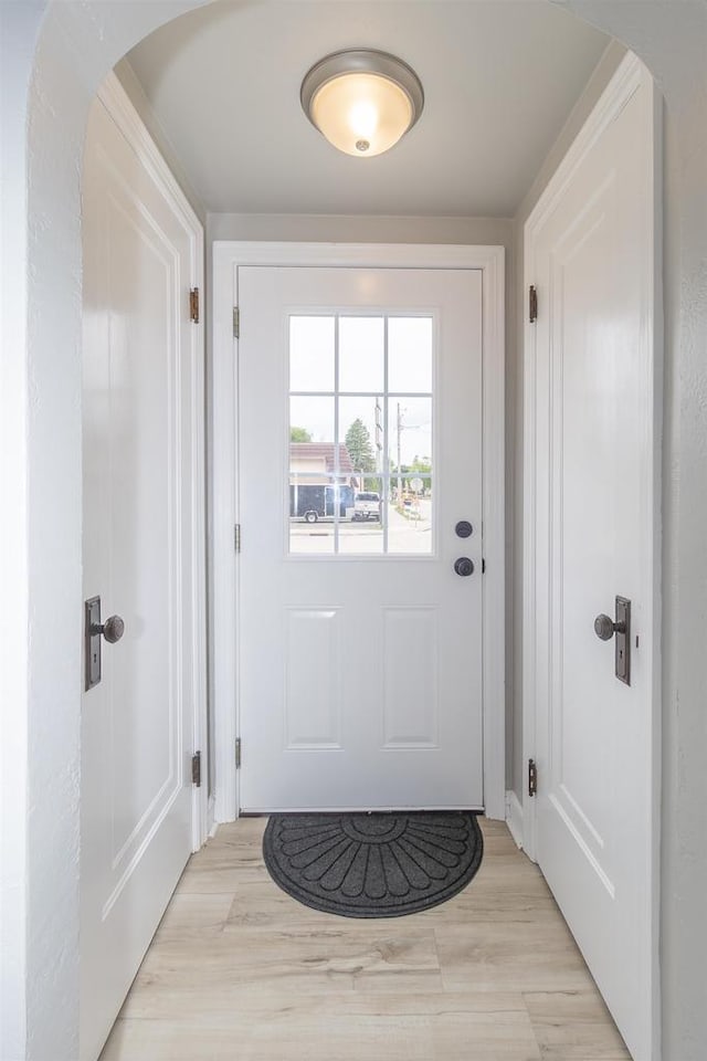 1614 N Richmond St, Appleton, WI 54911 - doorway with arched walkways and light wood-type flooring