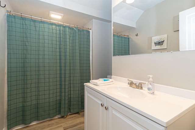 1614 N Richmond St, Appleton, WI 54911 - full bath with wood finished floors, vanity, and a shower with shower curtain