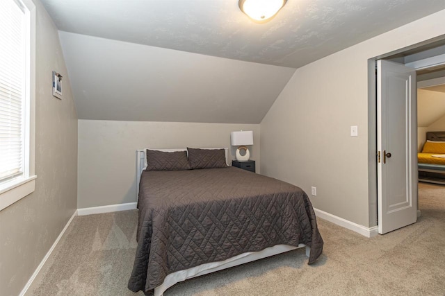 1614 N Richmond St, Appleton, WI 54911 - carpeted bedroom featuring vaulted ceiling and baseboards