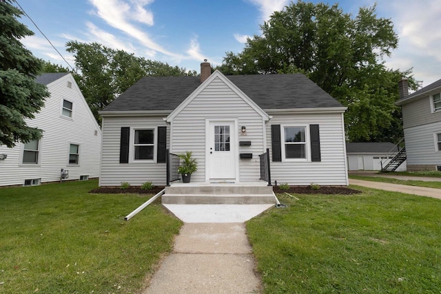 1614 N Richmond St, Appleton, WI 54911 - view of front of property featuring a chimney, a front yard, and roof with shingles