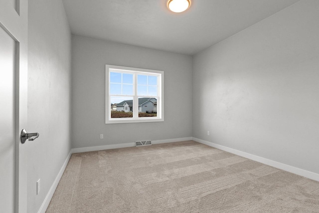 1925 Creekwood Ct, Manitowoc, WI 54220 - carpeted empty room featuring baseboards
