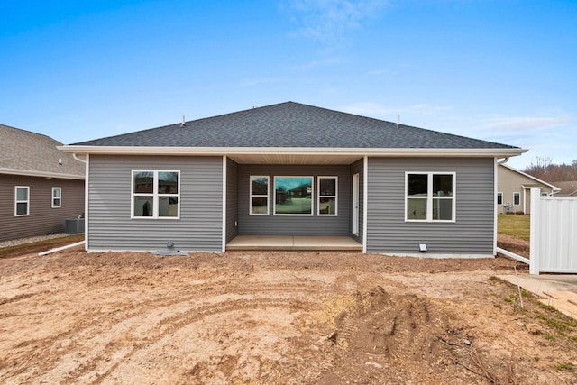 1925 Creekwood Ct, Manitowoc, WI 54220 - rear view of property with a shingled roof and central air condition unit